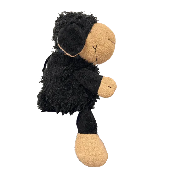 Doudou d'un mouton noir se tenant assis